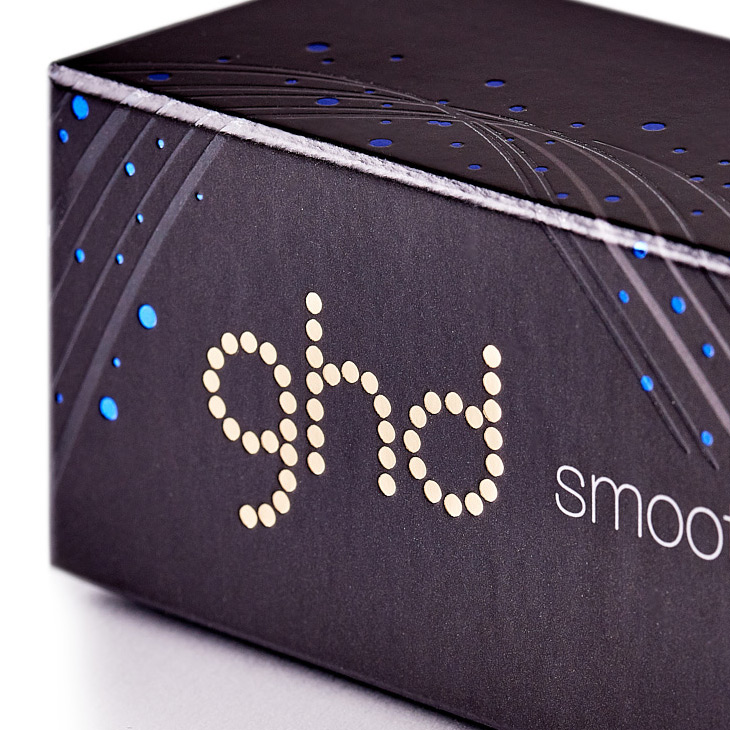 Black packaging with blue dots with GHD branding