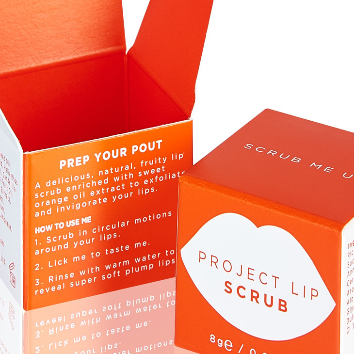Small square orange and white carton for Project Lip scrub