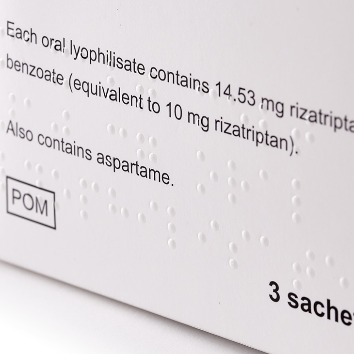 Close up of white packaging with braille