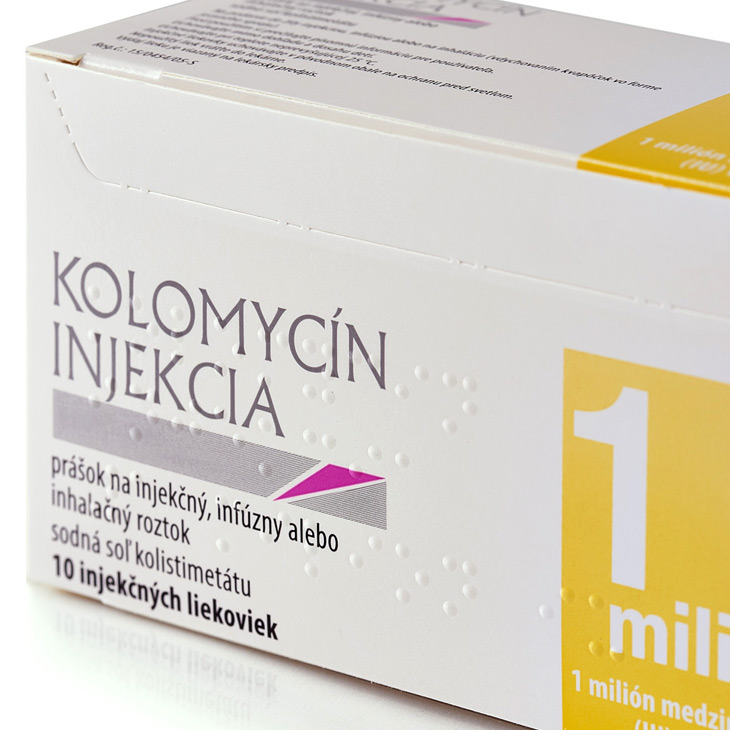 Close up of white and yellow medical carton with braille
